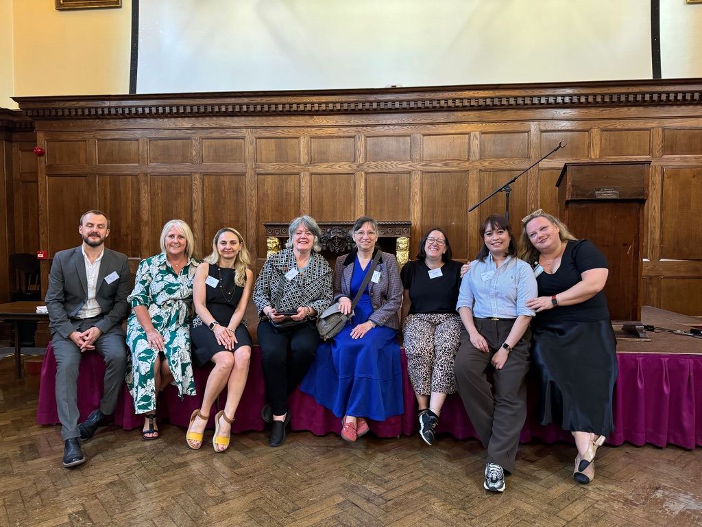Conference speakers and organisers gathered on stage
